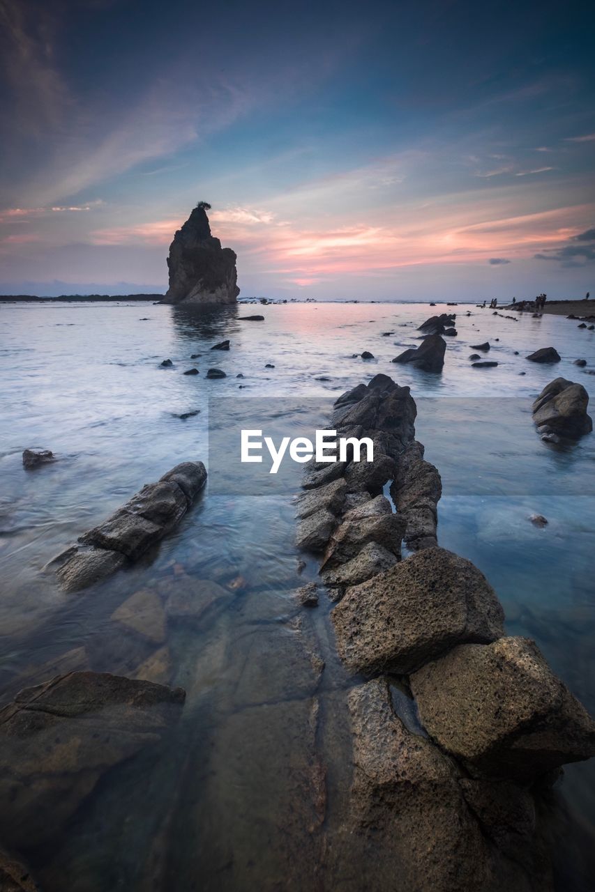 Scenic view of sea against sky at sunset