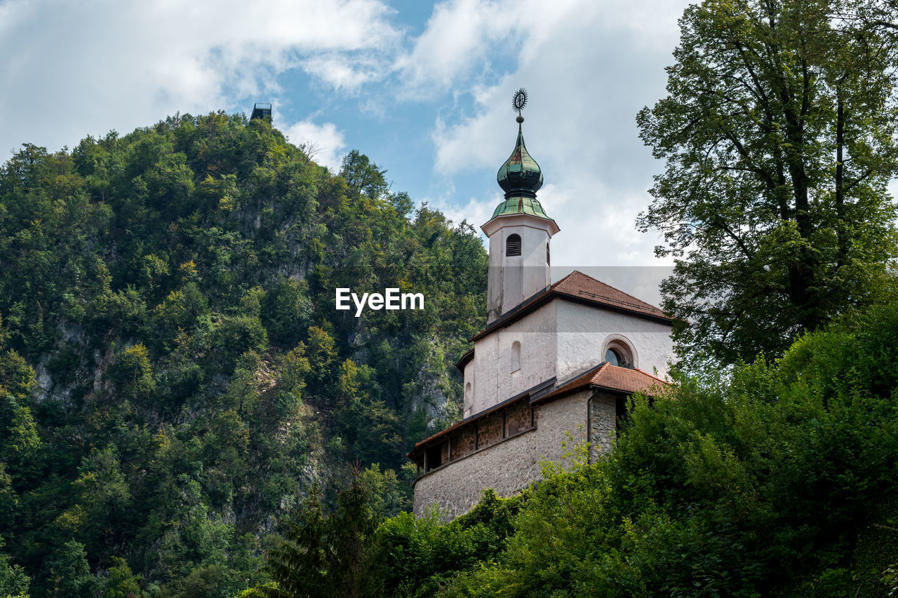 Small kamnik castle surrounded by greenery in slovenia.