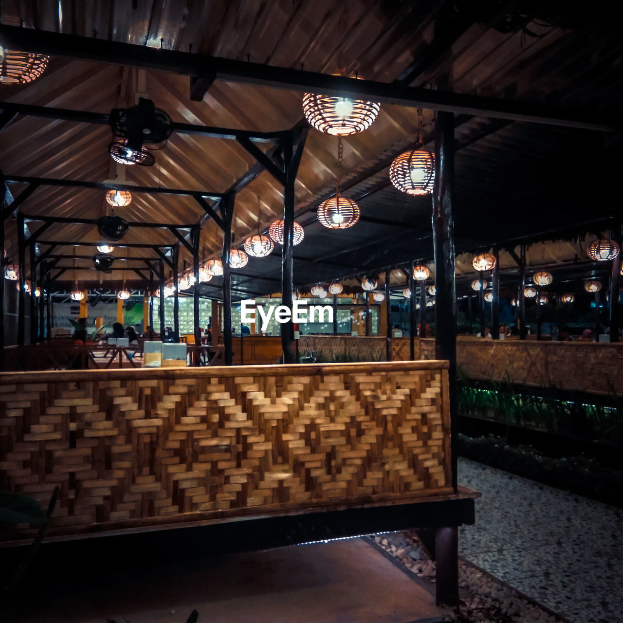 INTERIOR OF ILLUMINATED RESTAURANT AT SUBWAY STATION