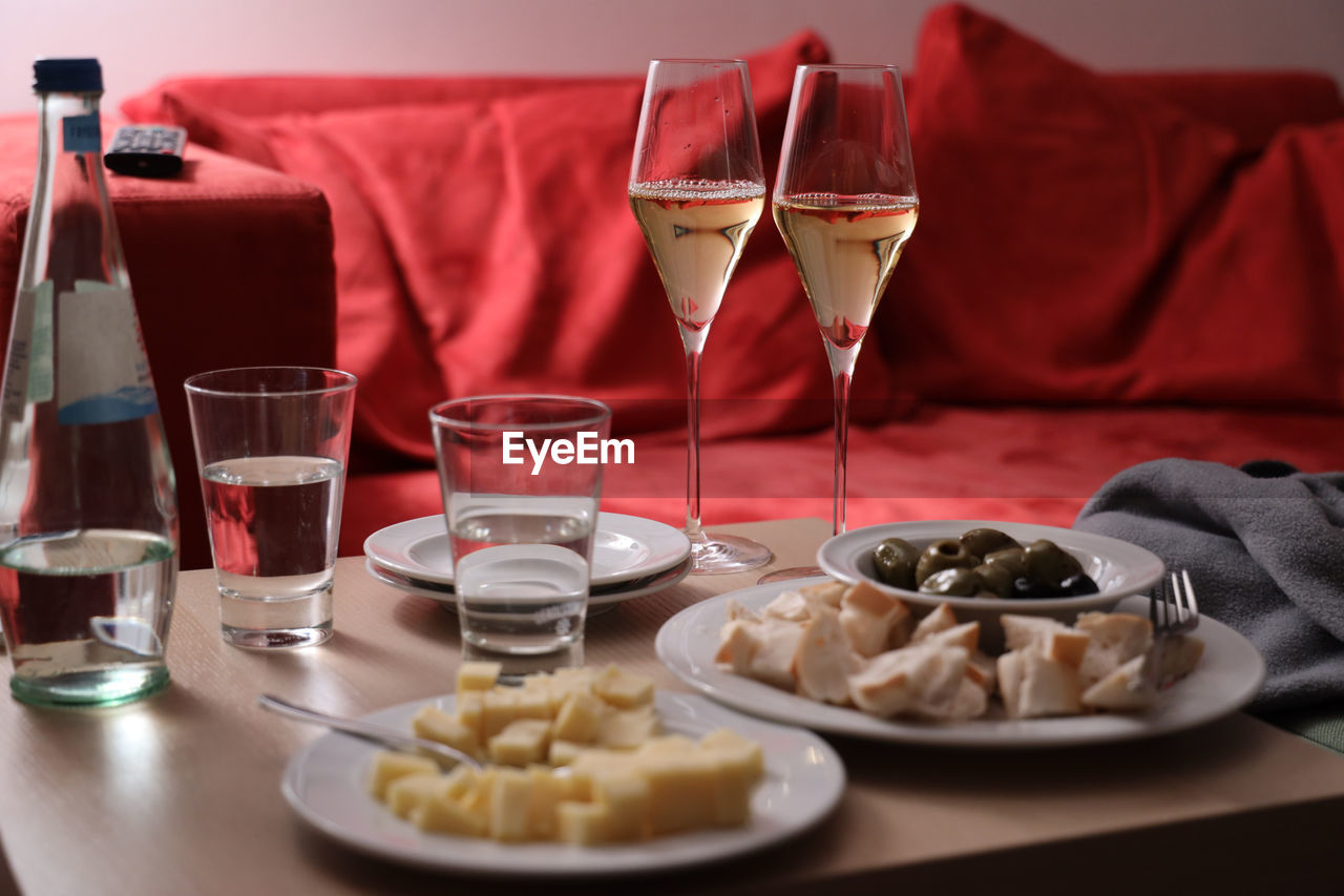 Romantic dinner for two with wine, cheese and olives.