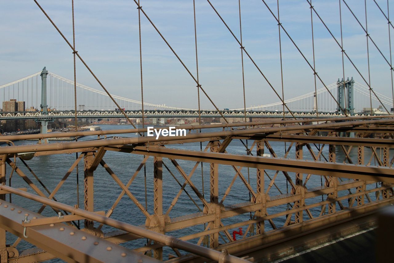 View of suspension bridge against blue sky