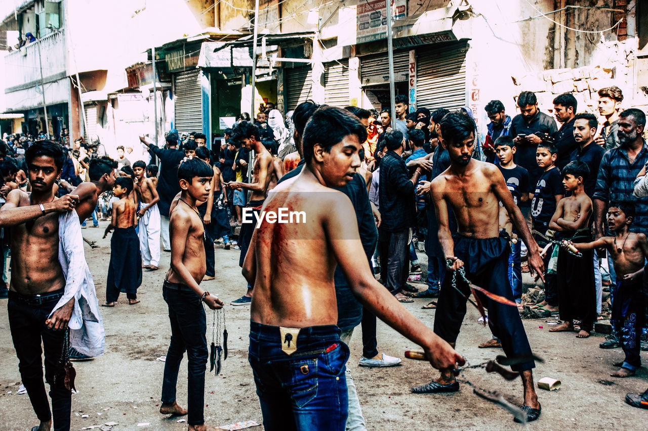 GROUP OF PEOPLE AT STREET MARKET