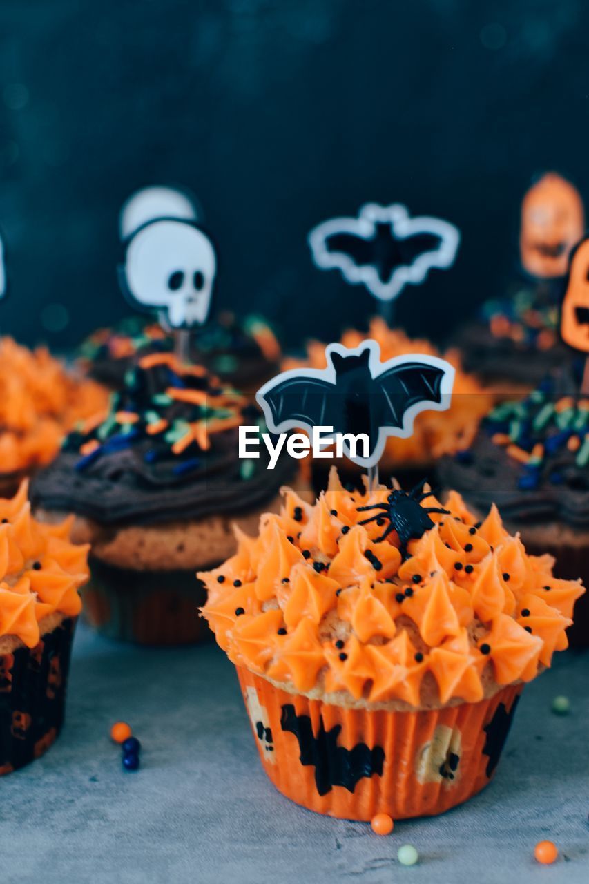 food, dessert, cake, celebration, food and drink, sweet food, no people, halloween, representation, sweet, baked, muffin, cupcake, tradition, decoration, animal representation, focus on foreground, animal, flower, creativity