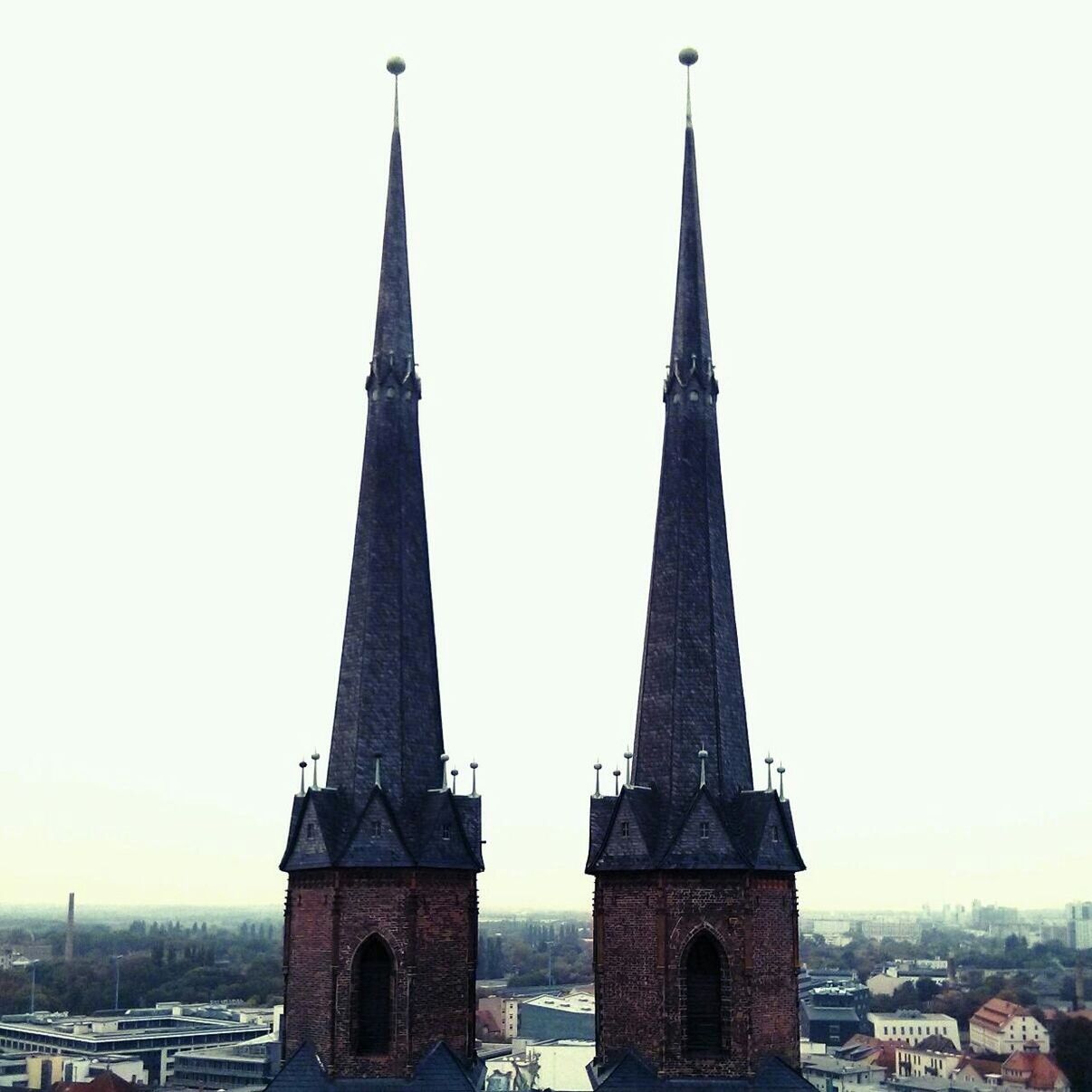 View of twin steeples against clear sky