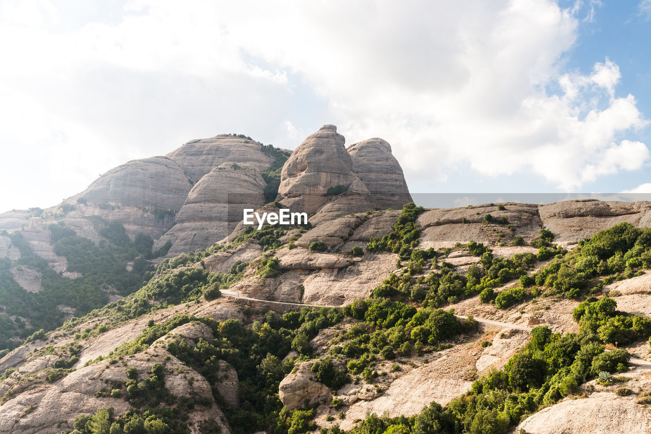 Scenic view of rocky mountains against sky