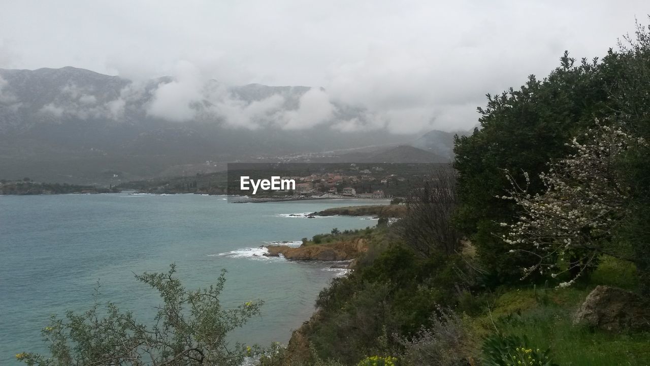 SCENIC VIEW OF SEA AND MOUNTAIN