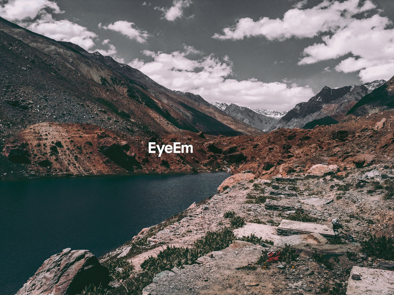 Scenic view of lake and mountains against sky