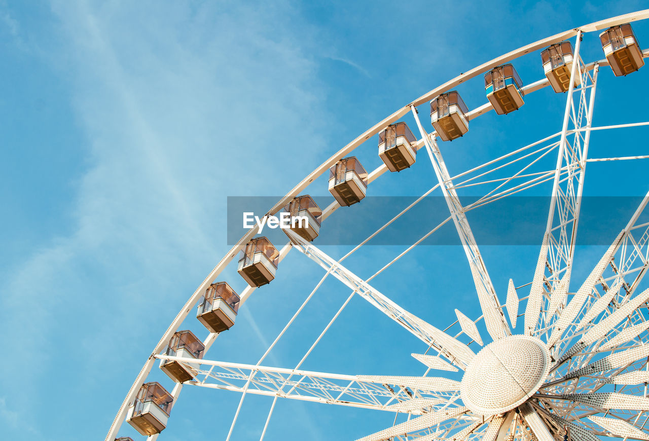 Low angle view of ferris wheel against sky