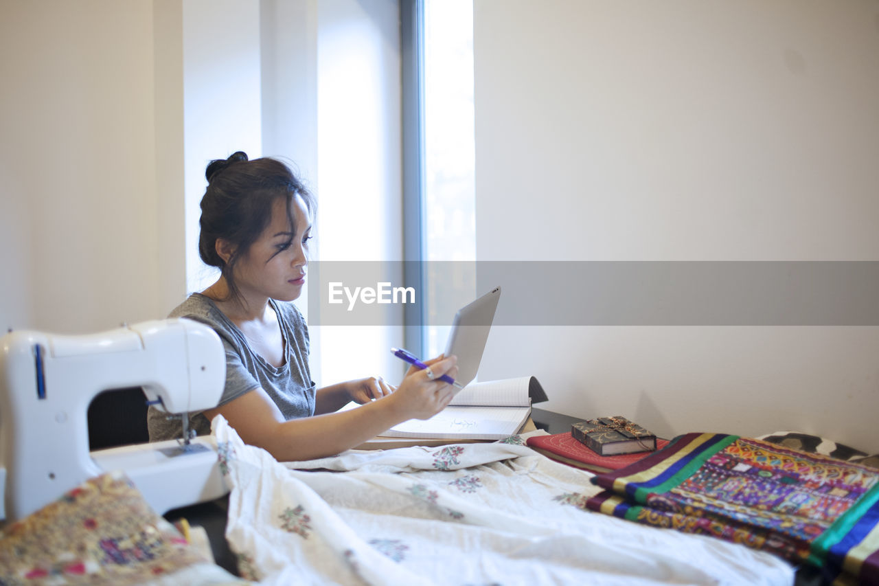 Young woman working on a tablet pc