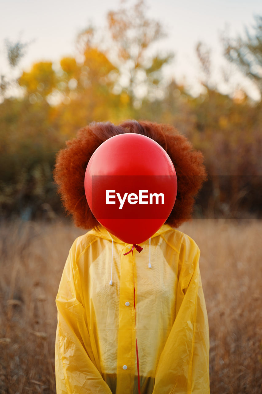 CLOSE-UP OF RED BALLOON ON BALLOONS