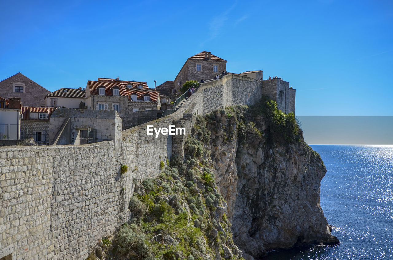 VIEW OF FORT AGAINST BUILDINGS