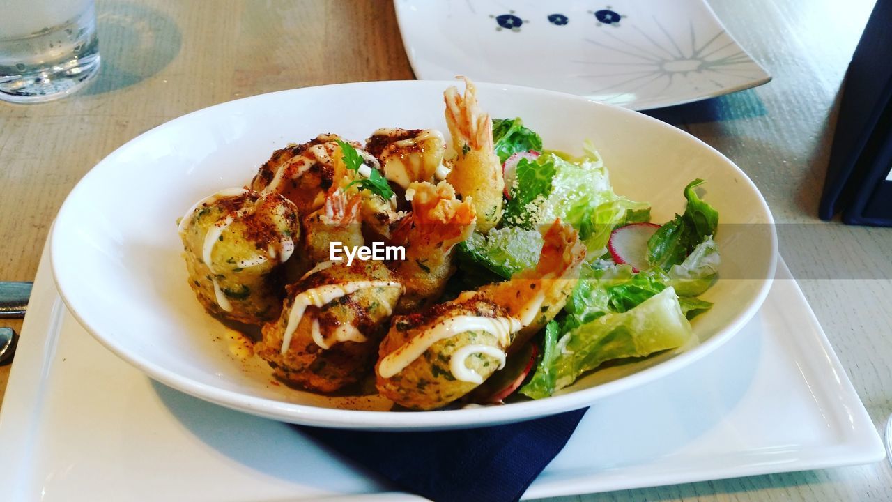 High angle view of salad in bowl on table