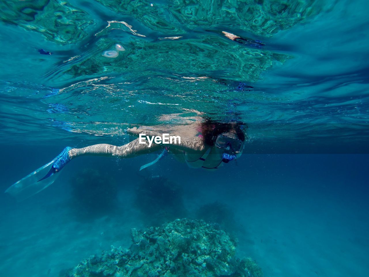 Full length of woman snorkeling undersea