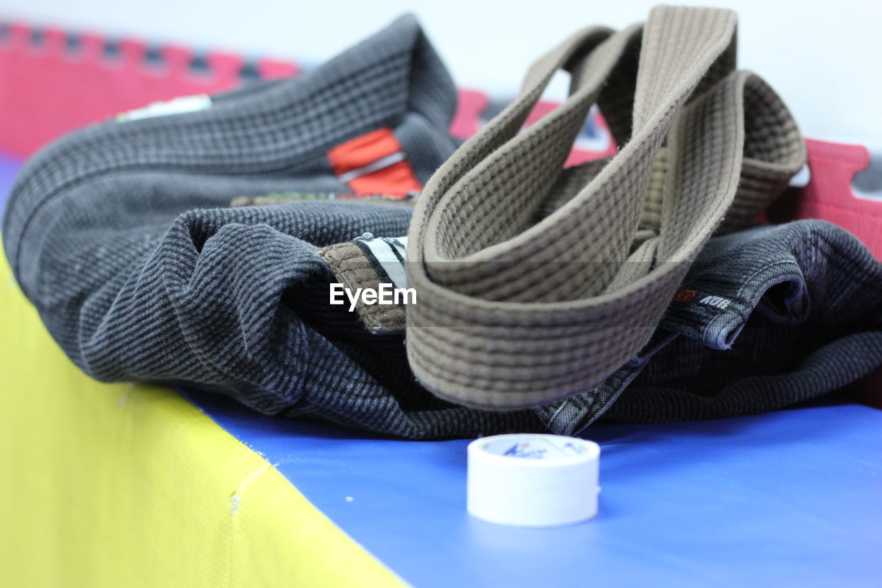 Close-up of karate belts on table