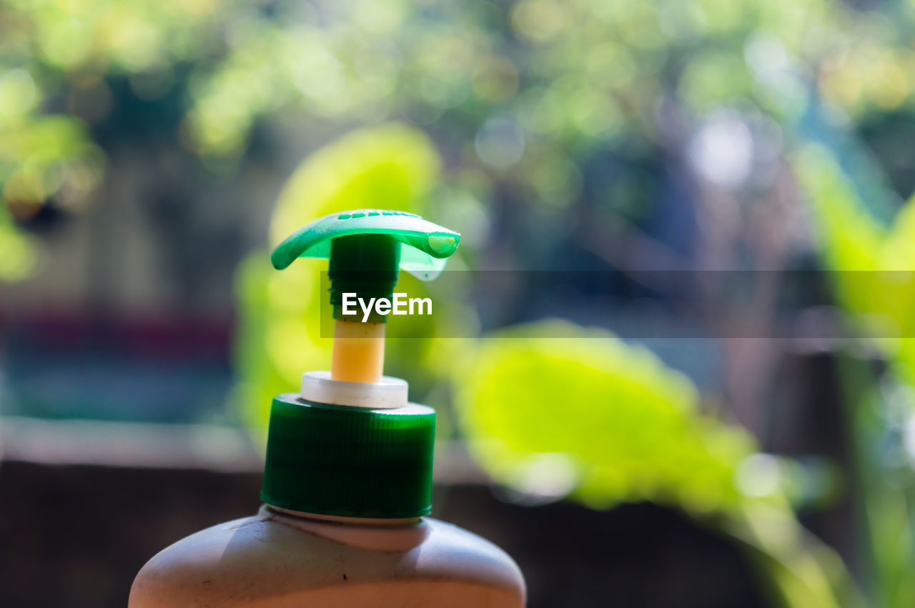 Close-up of multi colored sanitizer bottle