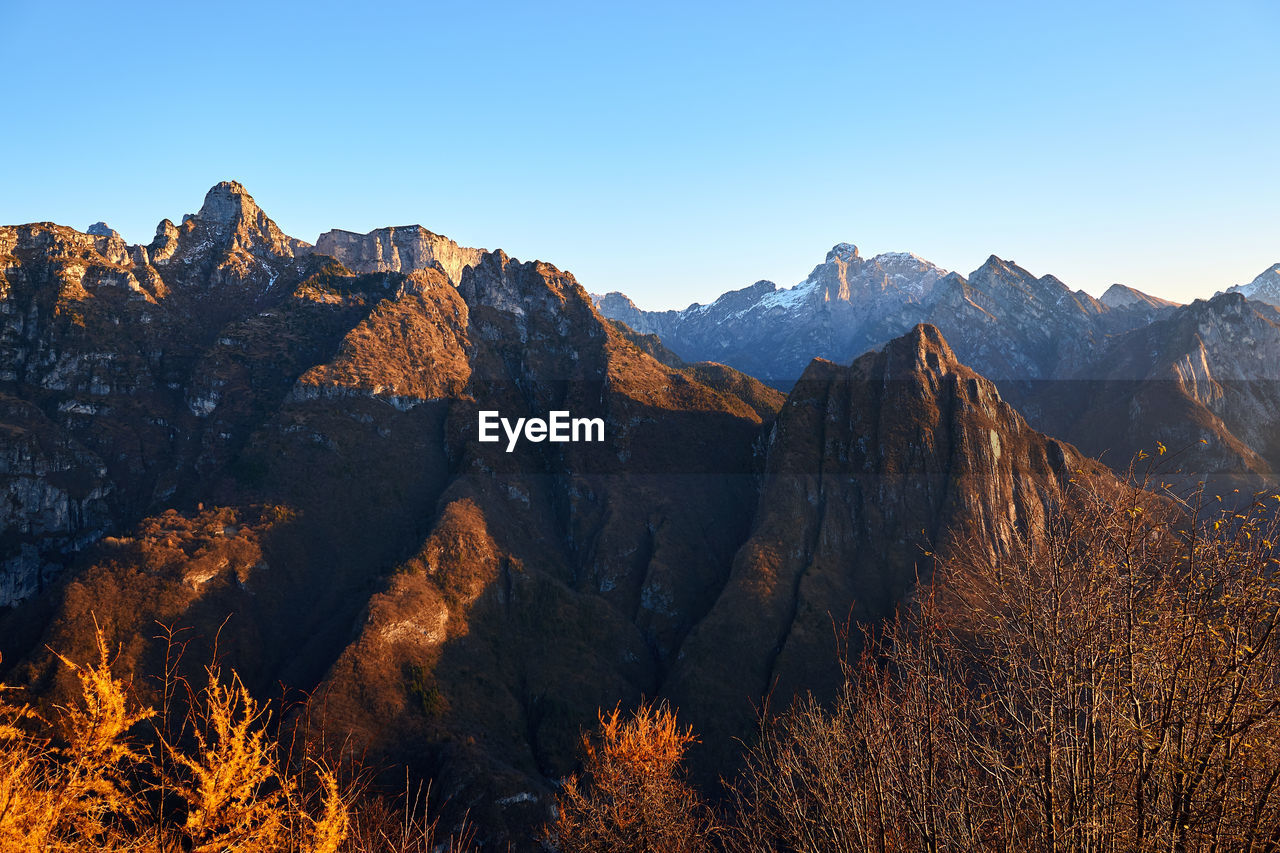 View of mountain range against clear sky