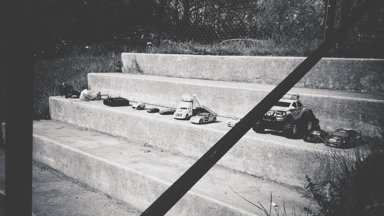 Collection of toy cars on steps