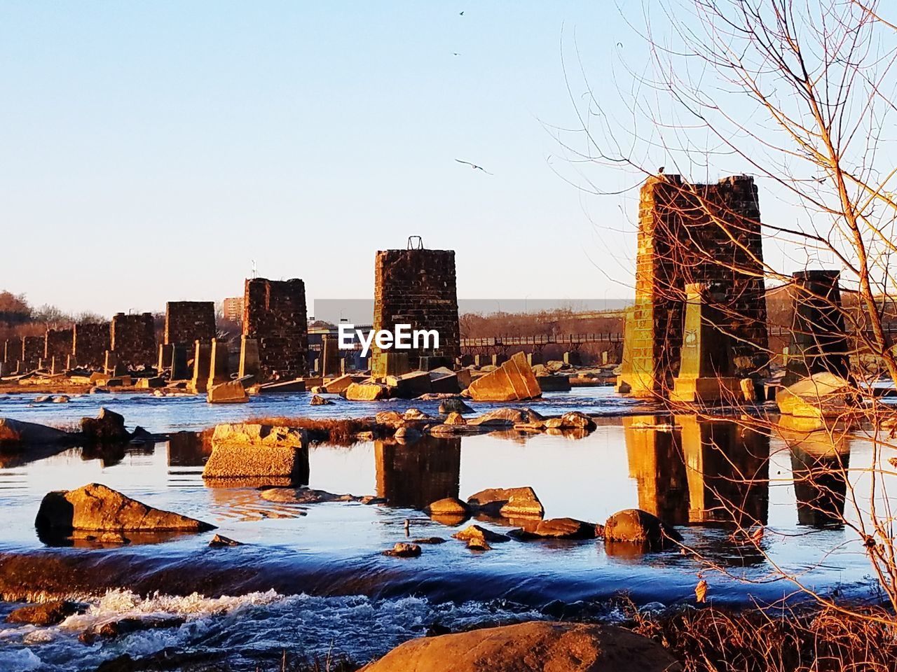 FROZEN LAKE AGAINST CLEAR SKY