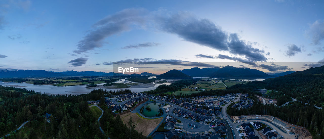 environment, mountain, landscape, sky, scenics - nature, mountain range, cloud, nature, beauty in nature, panoramic, land, travel destinations, travel, snow, blue, sunset, architecture, water, city, plant, cold temperature, no people, tranquility, outdoors, tree, winter, forest, aerial photography, tourism, rural scene, building, valley, sun, tranquil scene, dusk, activity, mountain peak, high angle view, built structure, summer, dramatic sky, sunlight, twilight, road, social issues, snowcapped mountain