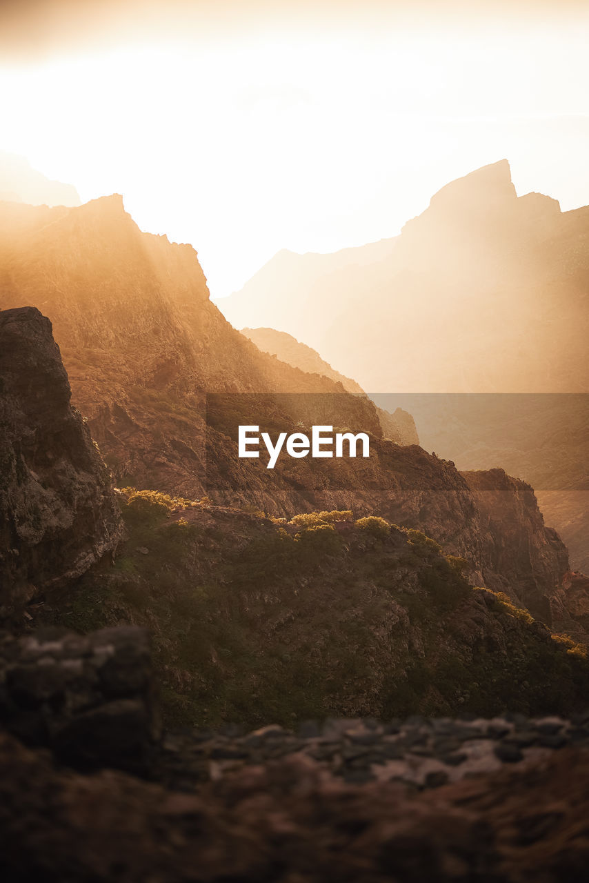 Scenic view of mountains against sky during sunset