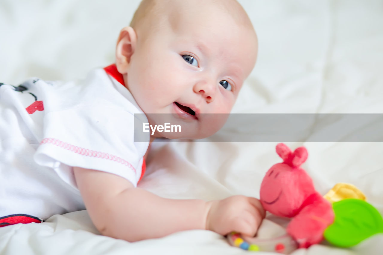 close-up of cute baby boy sleeping on bed