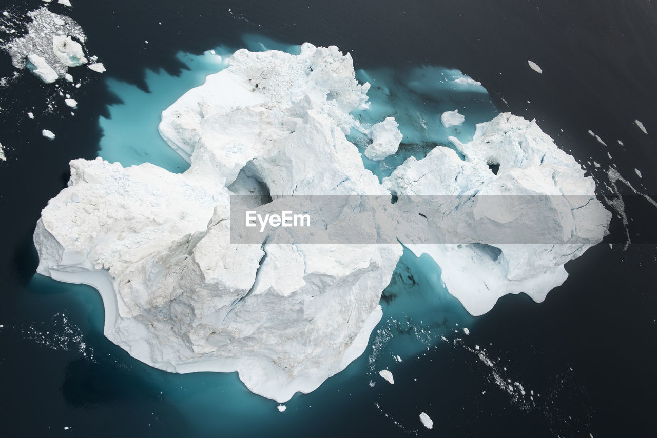 High angle view of icebergs in sea