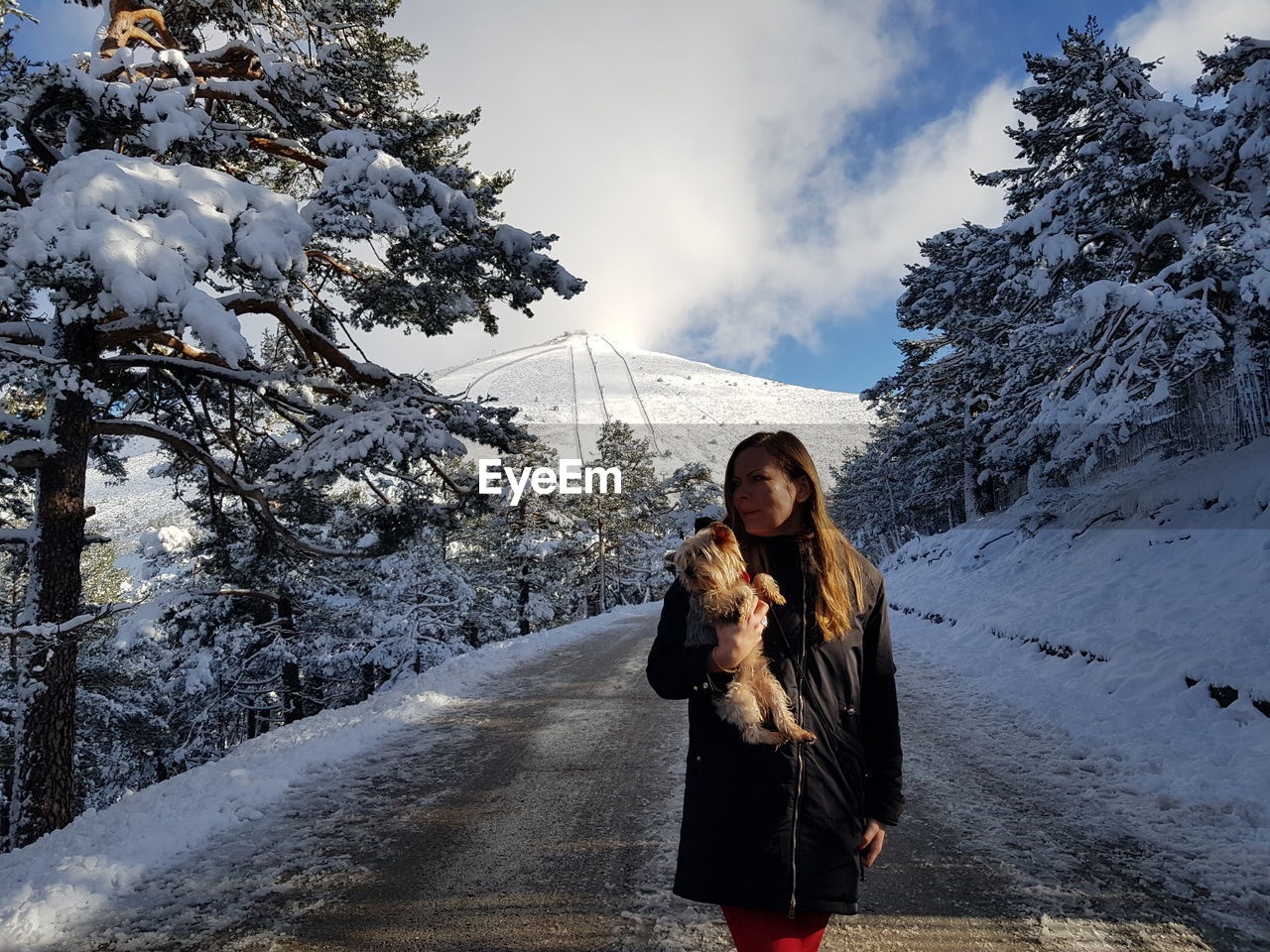 WOMAN WITH DOG IN WINTER