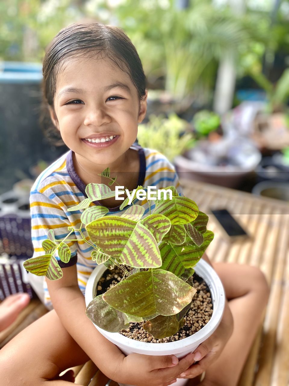 Portrait of smiling girl holding food