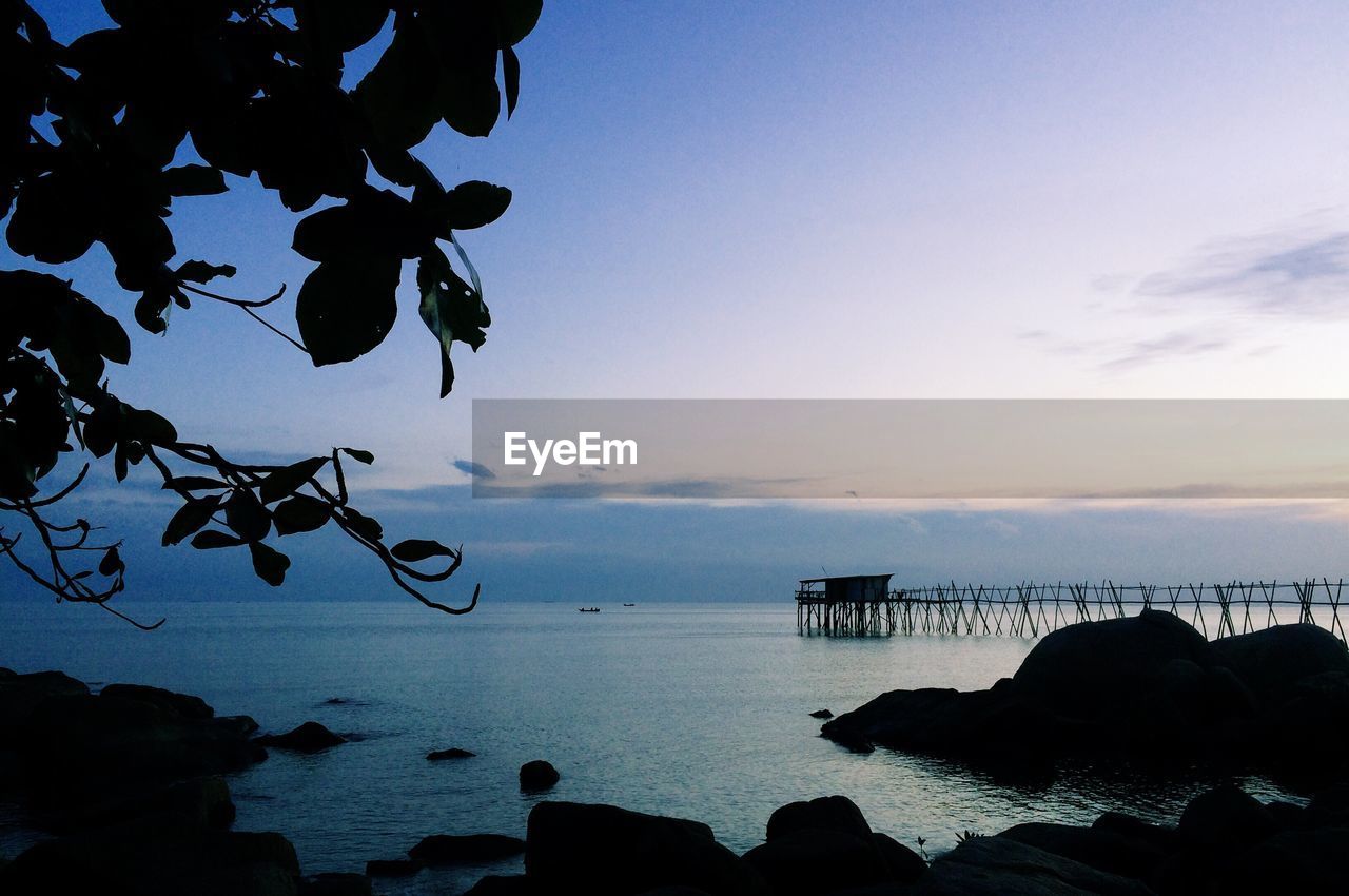 Scenic view of sea against sky at sunset