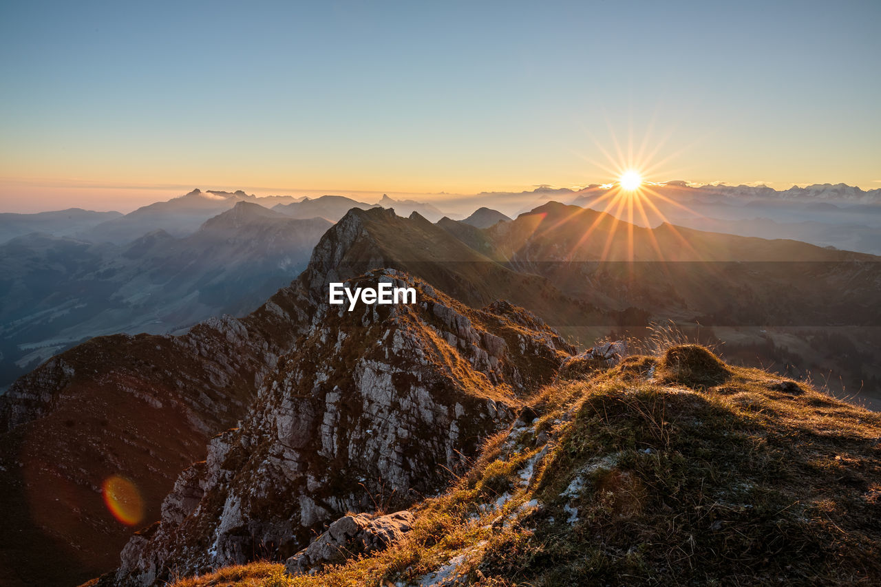 Scenic view of rocky mountains during sunset