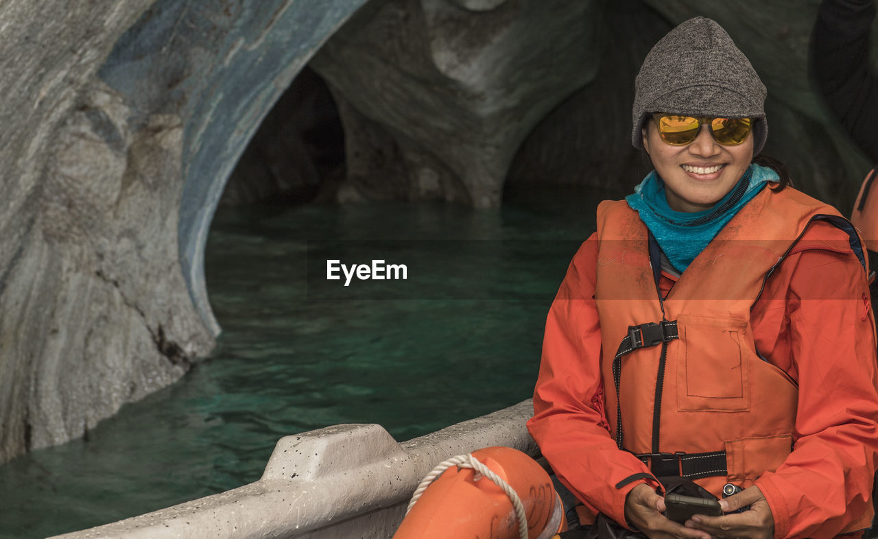 Woman admiring the marble caves, catedral de marmol, chile