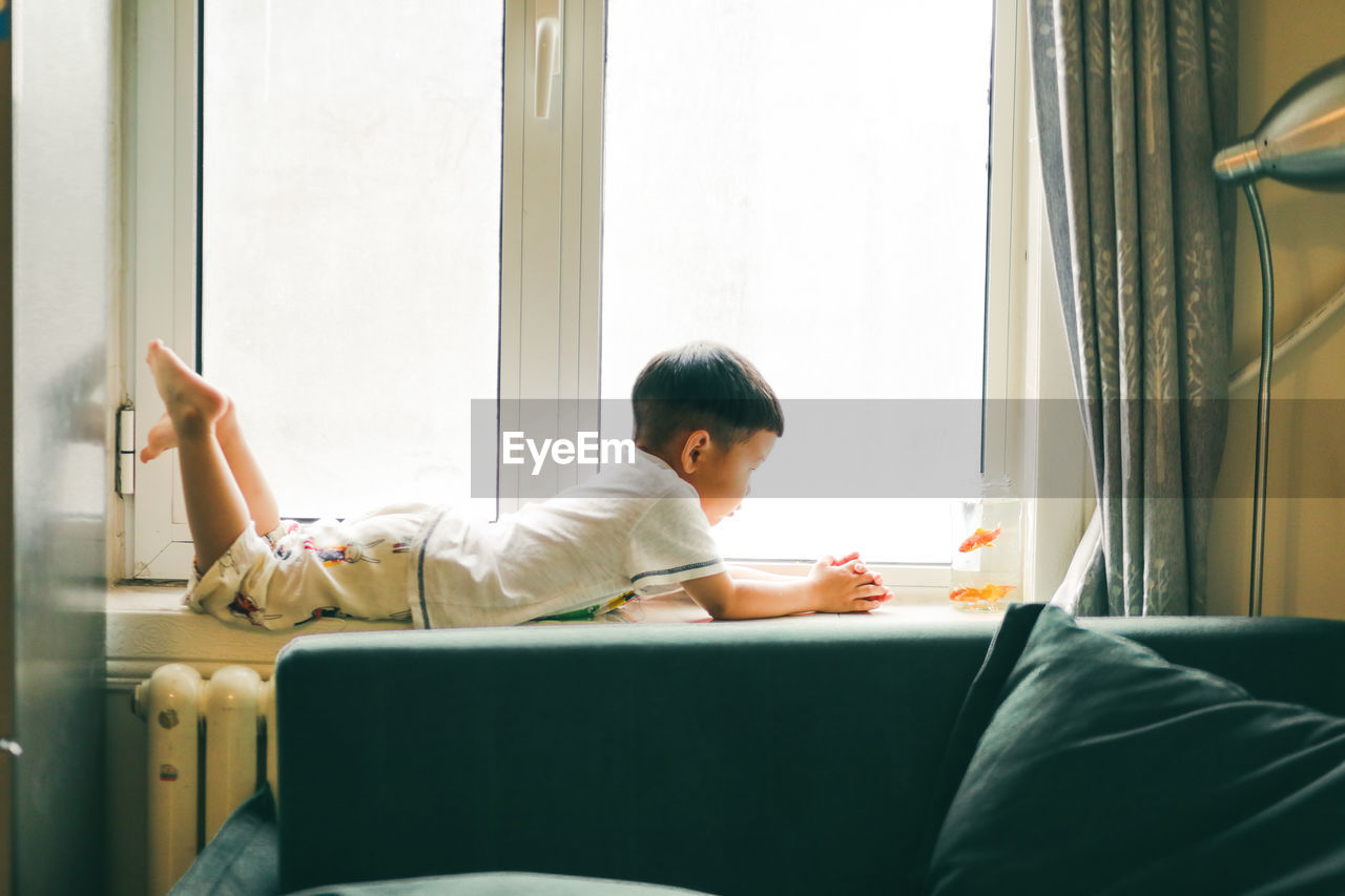 Man sitting on sofa at home