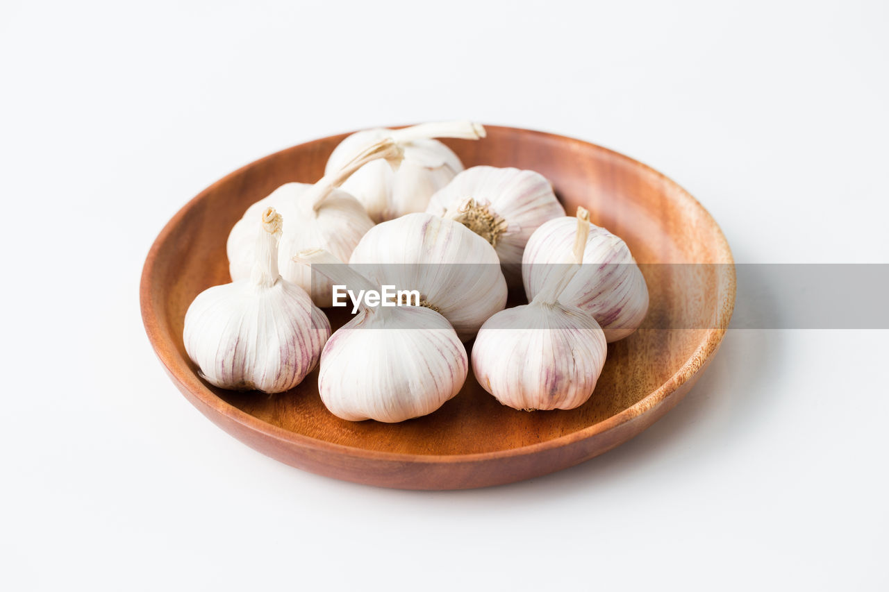 Garlic bulbs on the white background