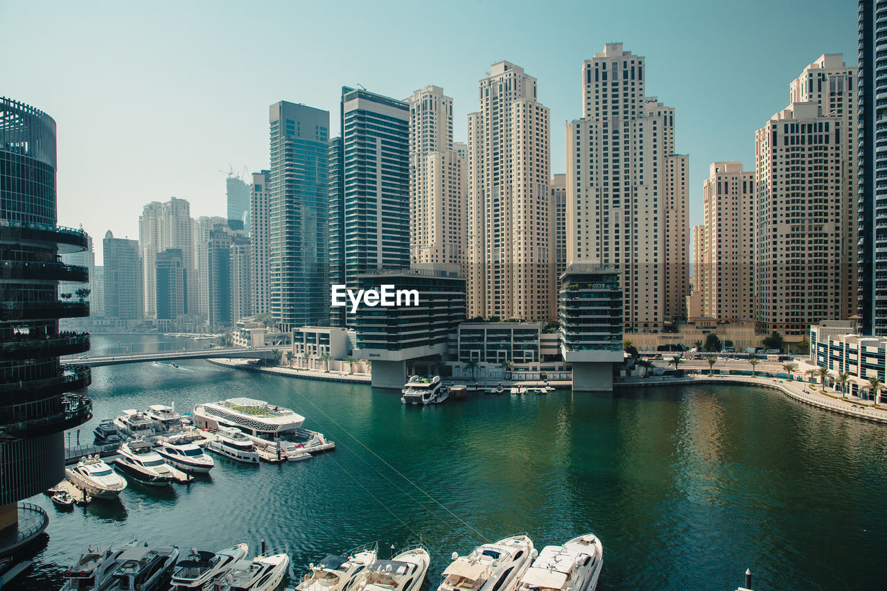 Dubai city in the uae. dubai marina. panoramic view of city buildings by sea against sky