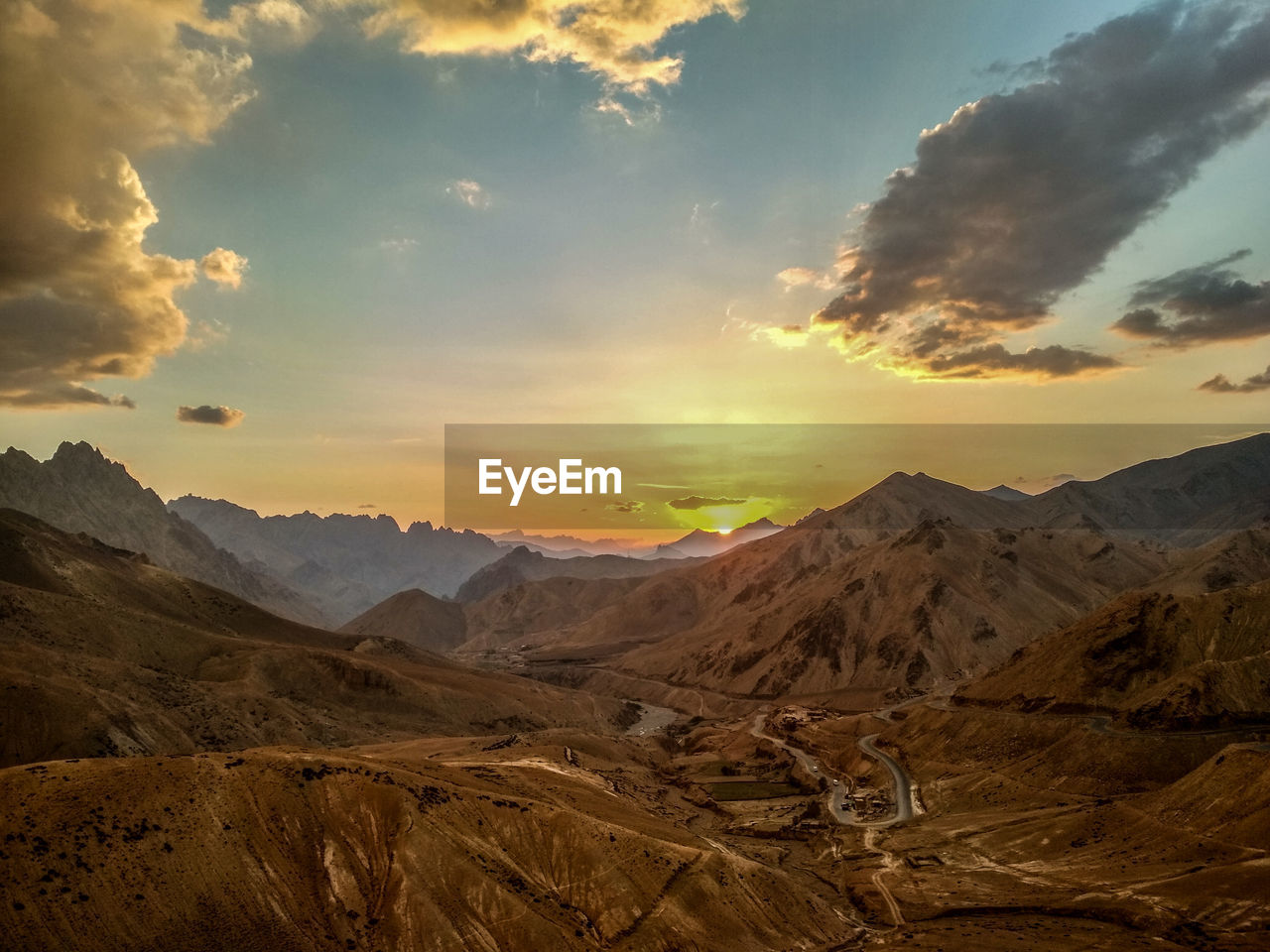 Scenic view of mountains against sky during sunset