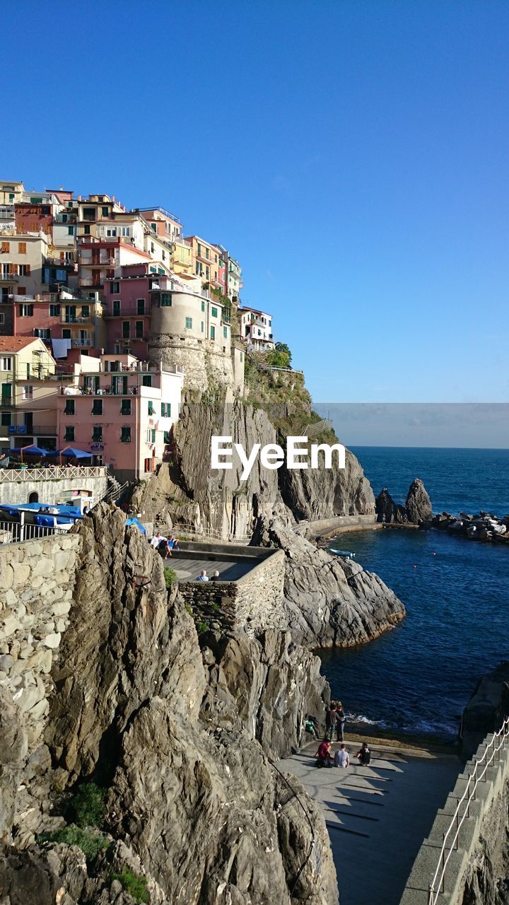 Panoramic view of sea against clear blue sky