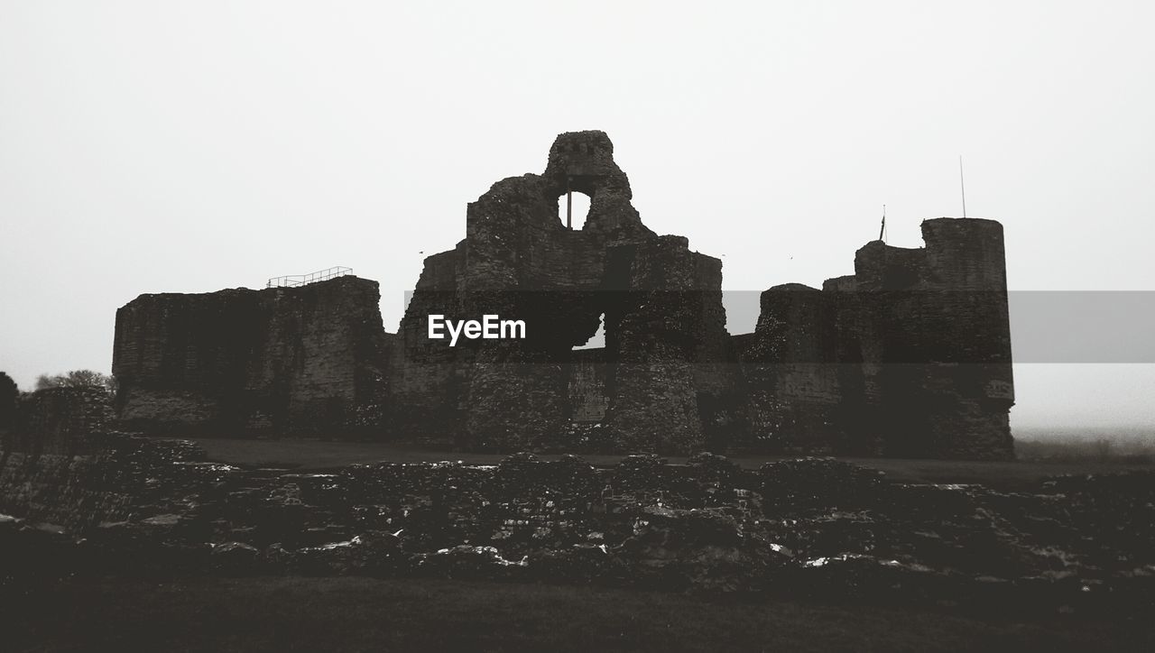 Exterior of rhuddlan castle against clear sky