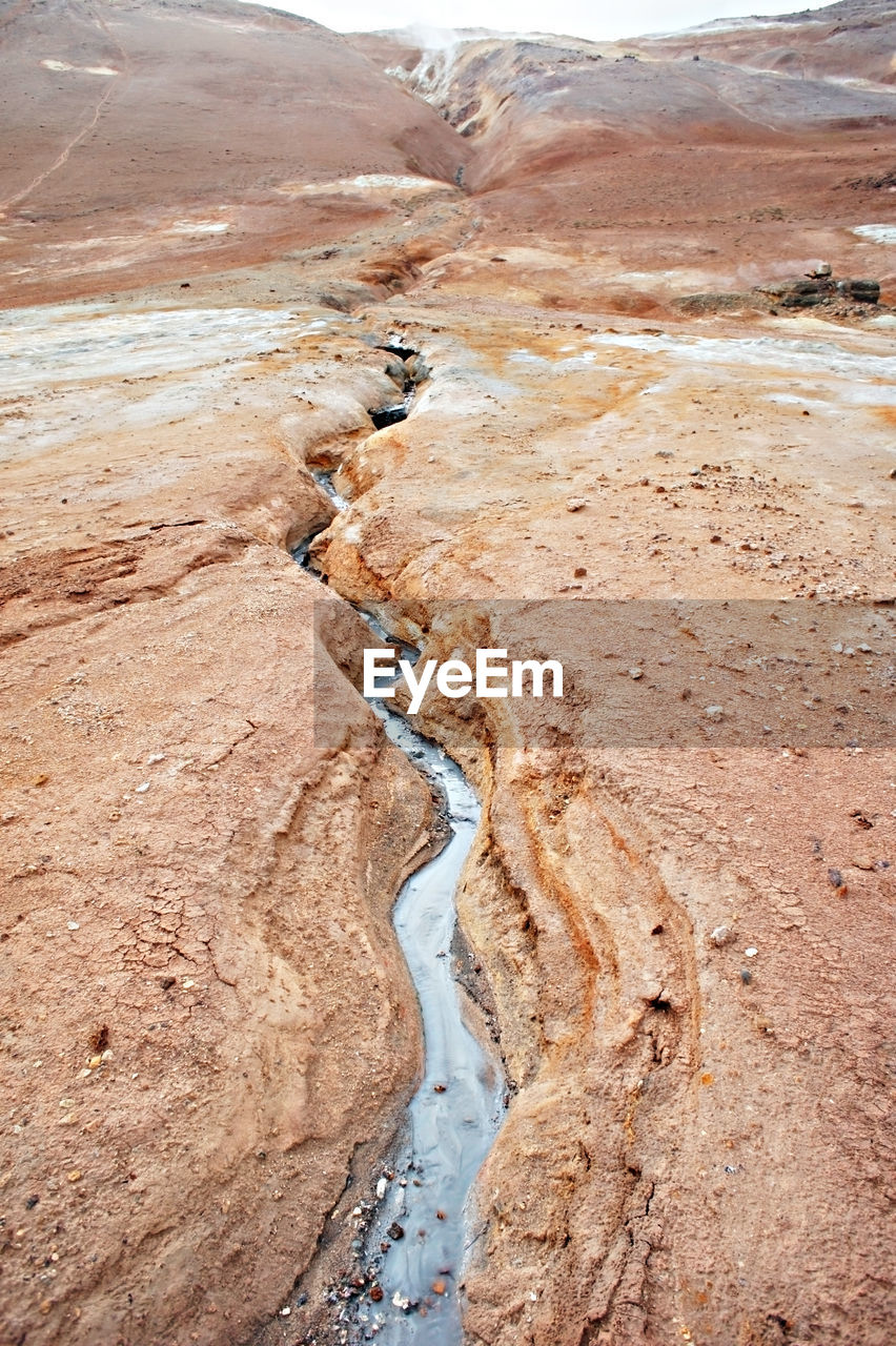 Hverir geothermal area in of iceland, volcano cracked red ground, alternative energy, namafjall