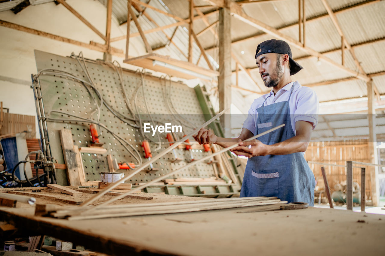 portrait of man working at construction site