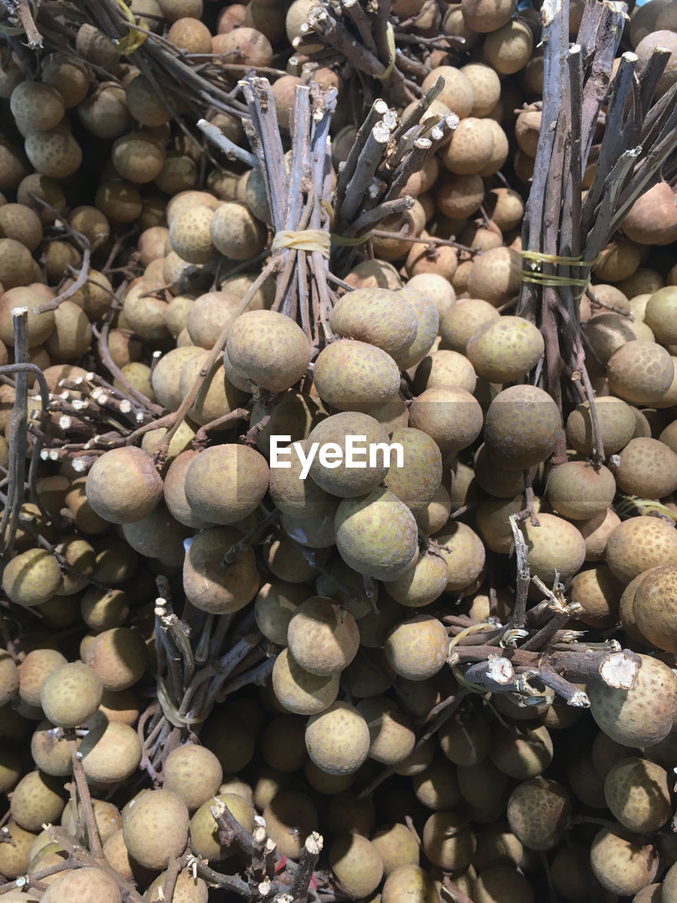 High angle view of longan fruits for sale at market