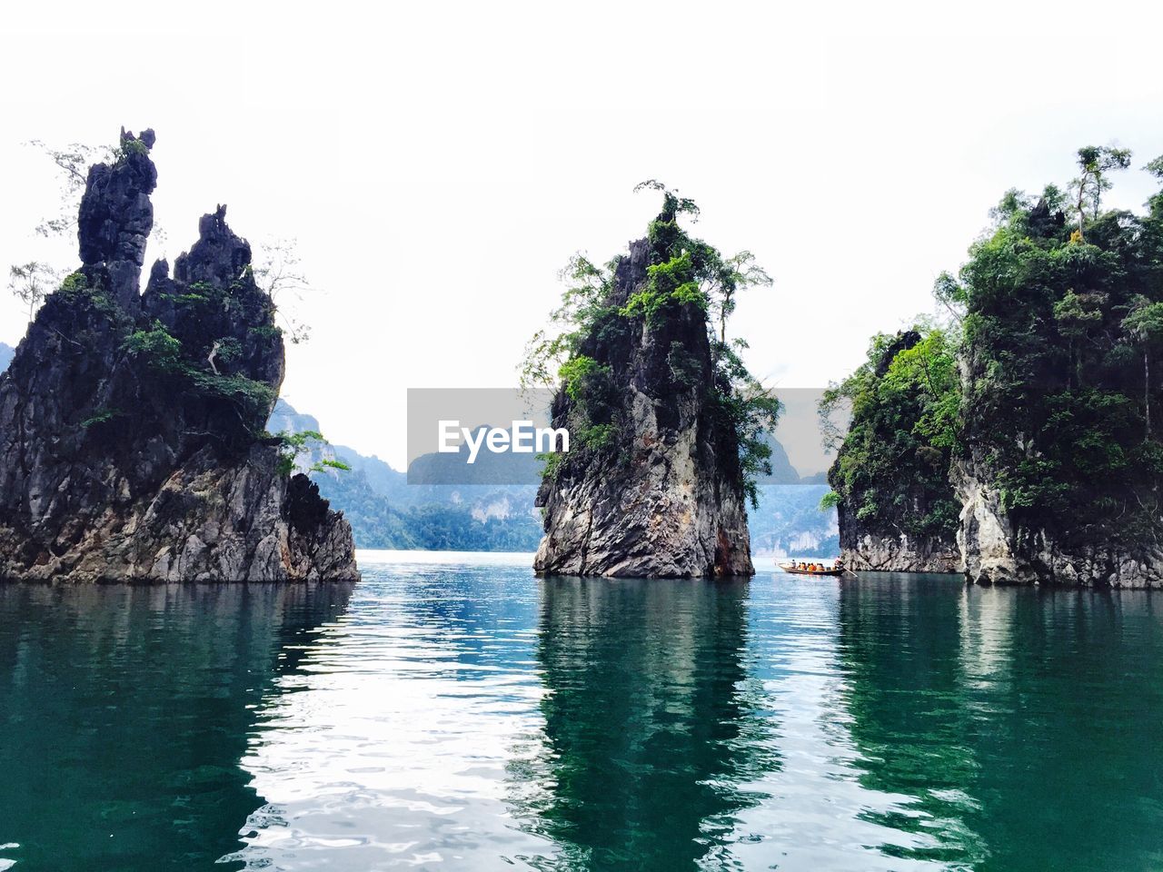 SCENIC VIEW OF SEA WITH ROCKS IN BACKGROUND