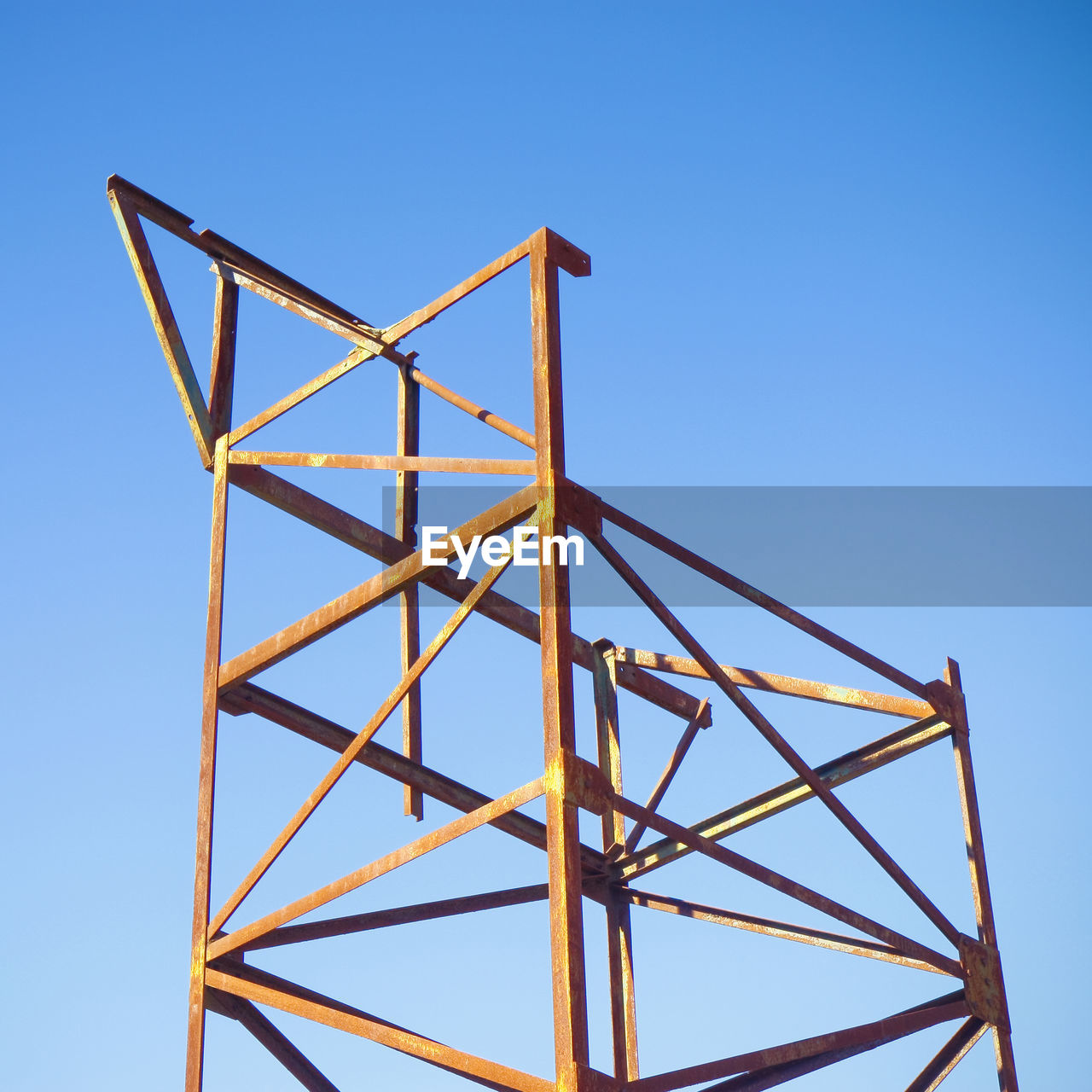 LOW ANGLE VIEW OF METALLIC STRUCTURE AGAINST CLEAR SKY
