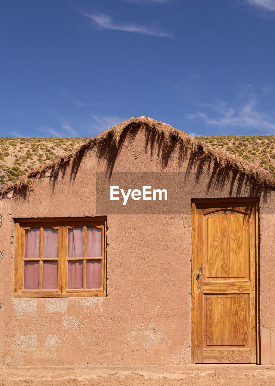 Color photography of house facade architecture in the atacama desert 