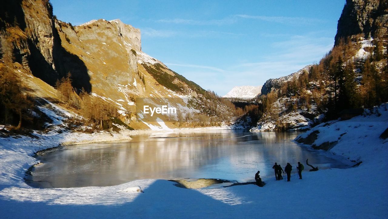 Scenic view of frozen lake against sky