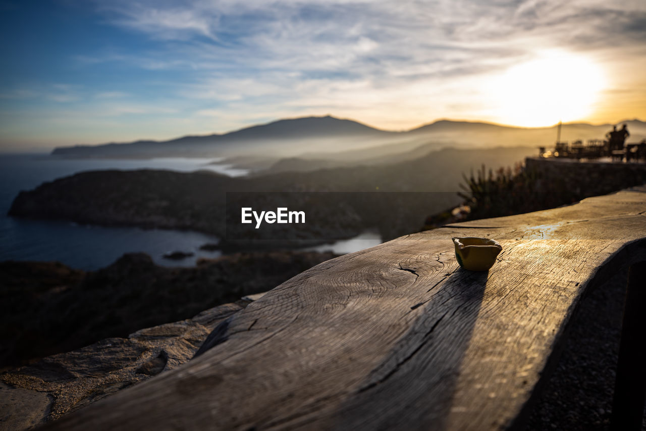 CLOSE-UP OF WOOD AGAINST SKY AT SUNSET