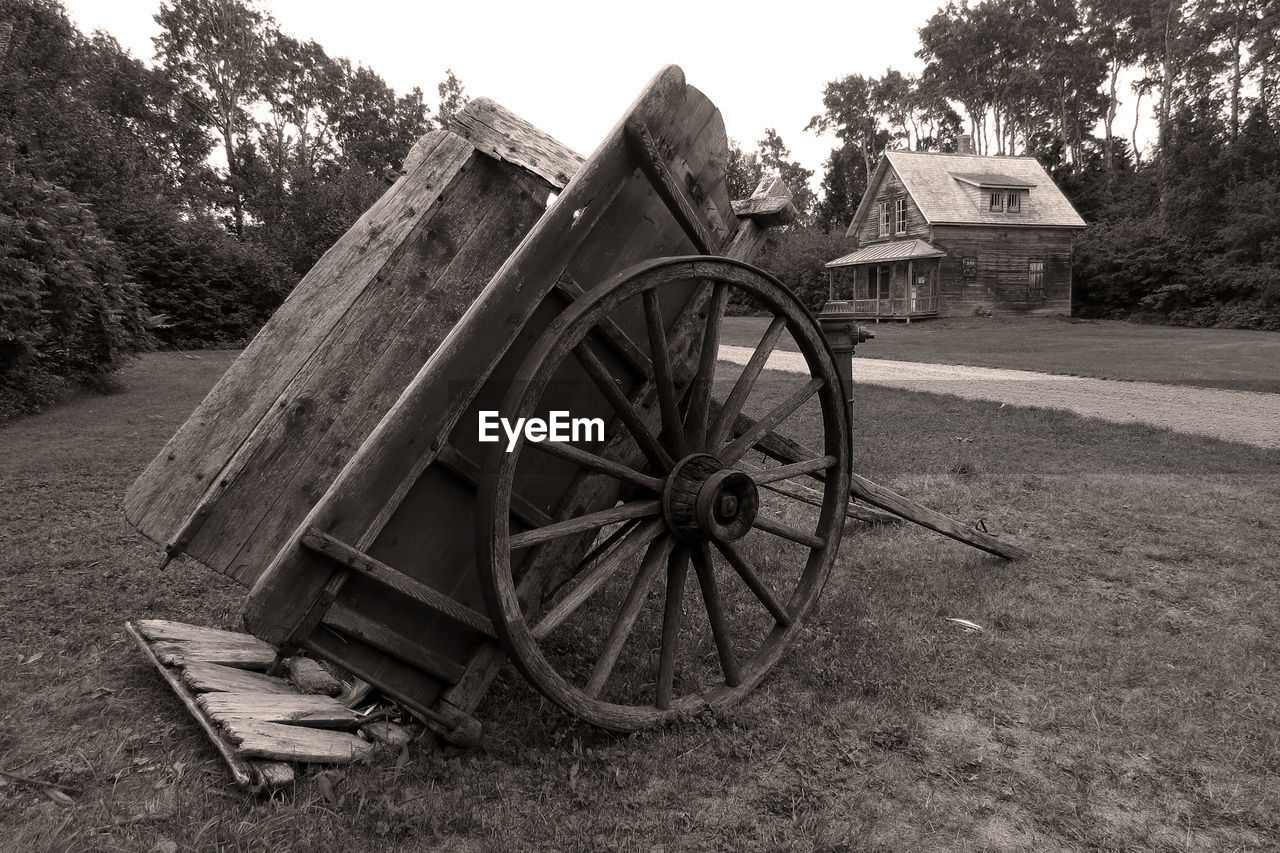 Old abandoned cart on field