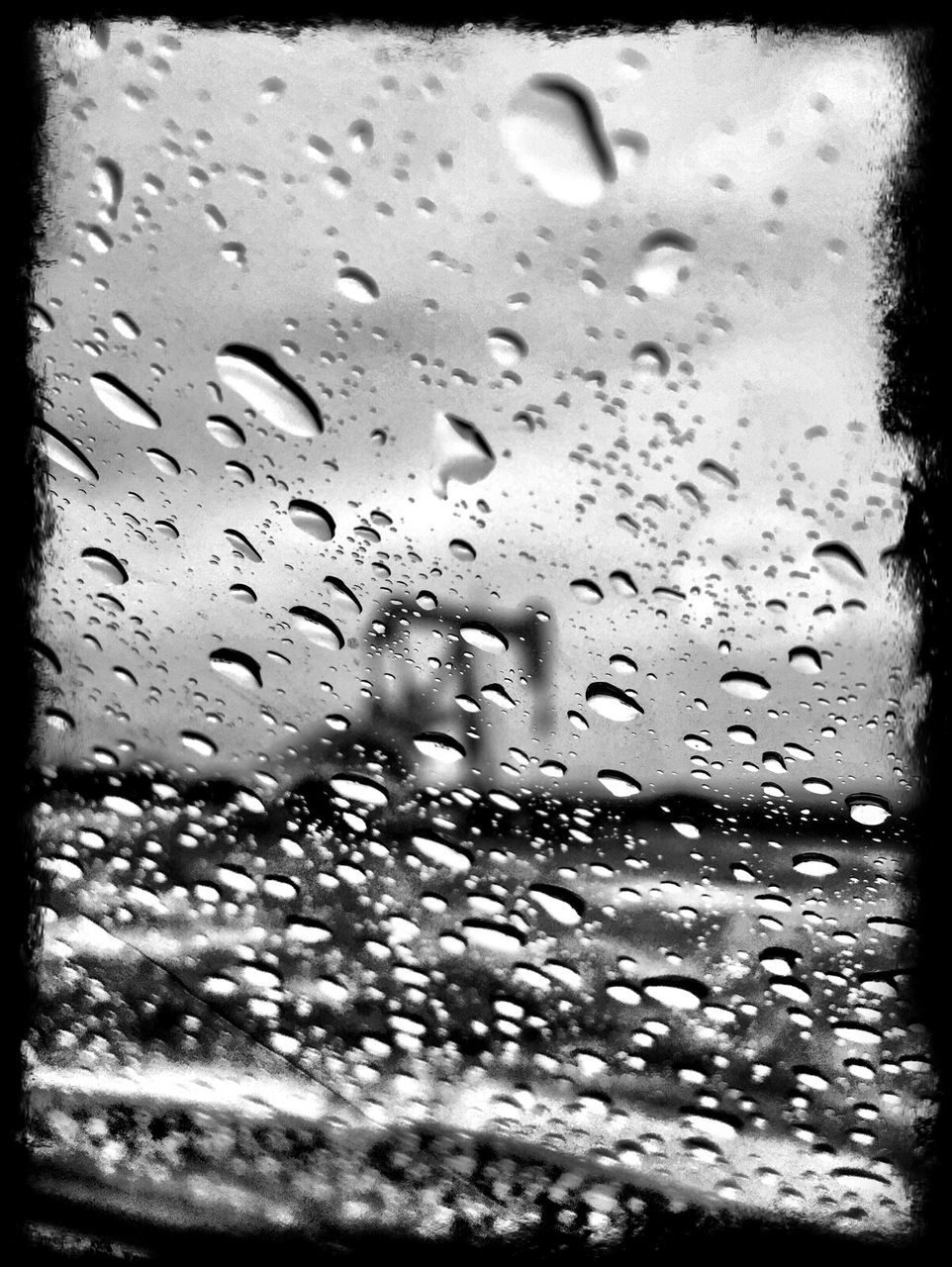 CLOSE-UP OF WATER DROPS ON GLASS WINDOW