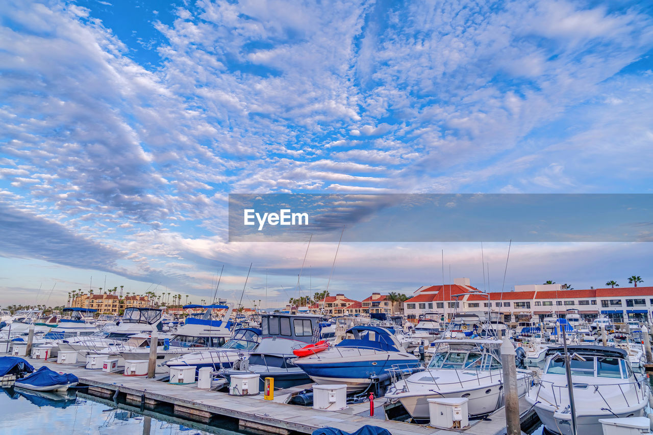 BOATS MOORED IN HARBOR