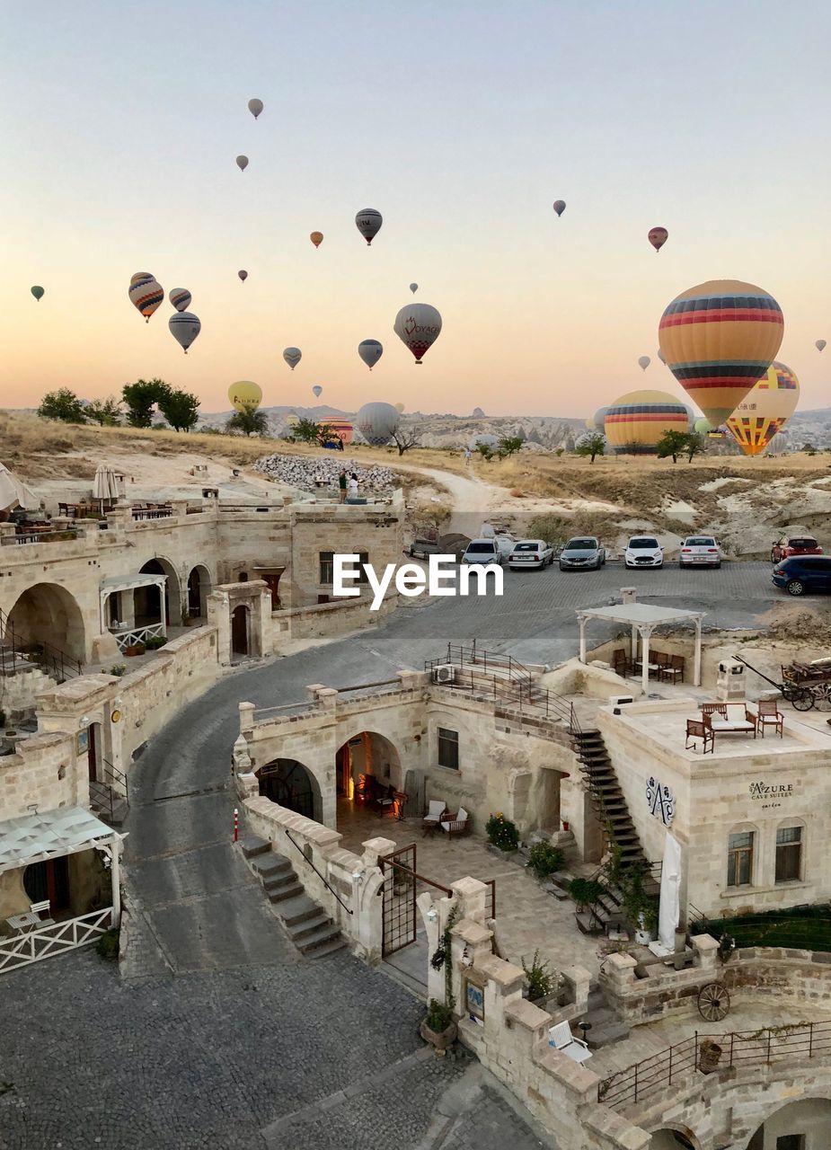 View of hot air balloon flying over city