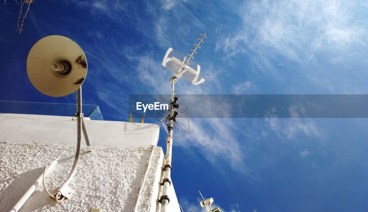 Nature theories- low angle view of telephone pole against sky